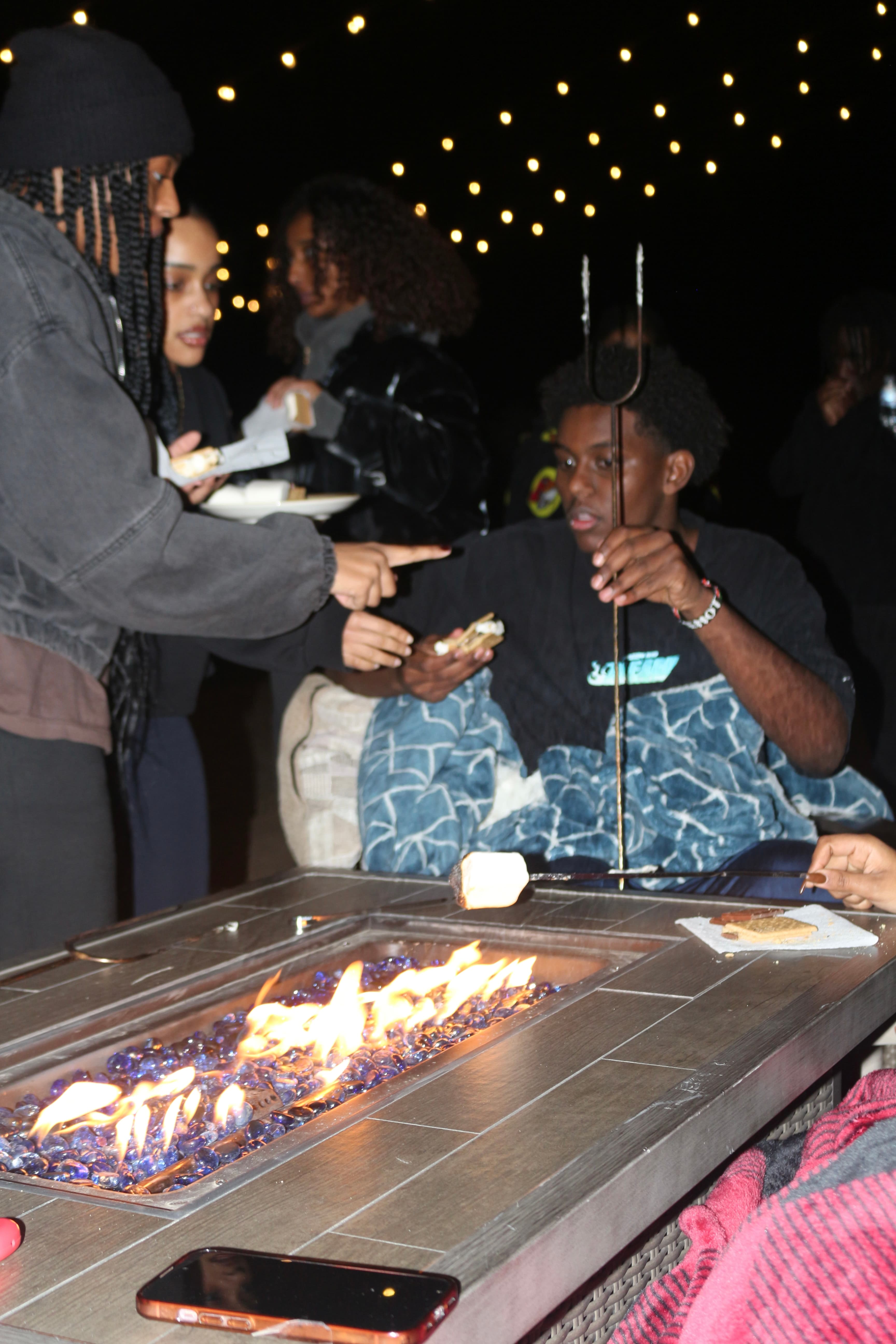 Roasting marshmallows at the firepit